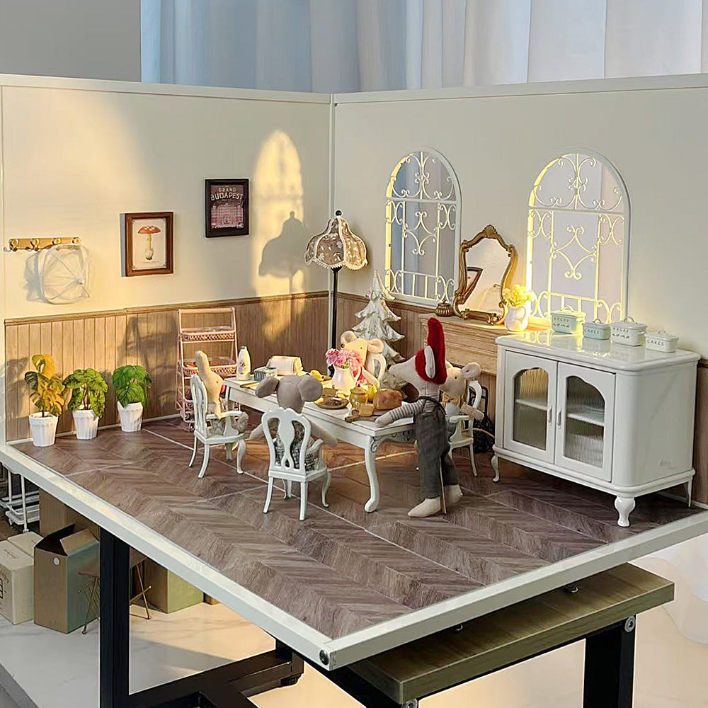 White Princess Chairs in a large 1:12 dollhouse room box with long table, cabinet, plants and warm window light