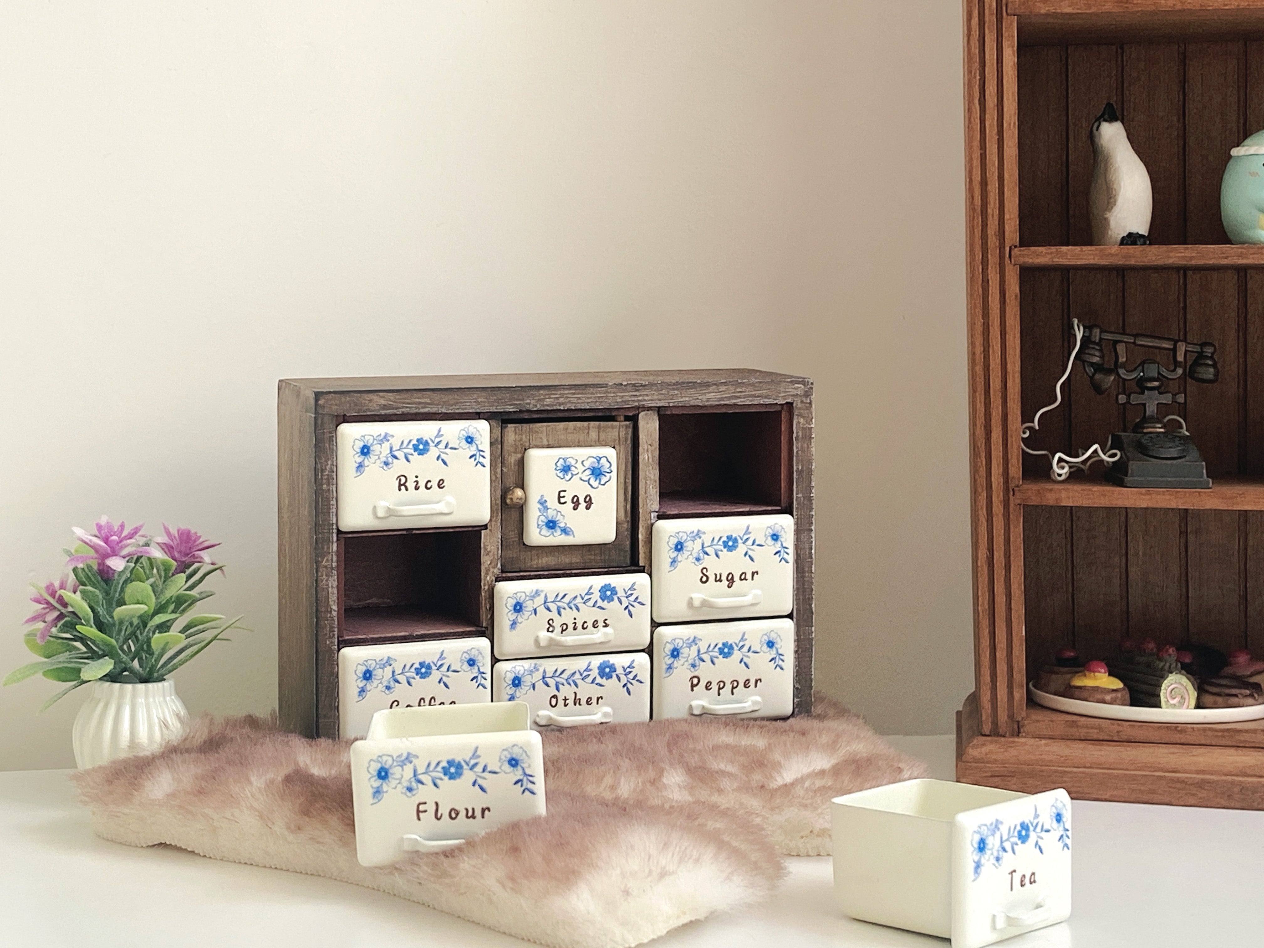 Antler Brown spice cabinet in cozy pantry scene with open drawers and removable floral metal drawers
